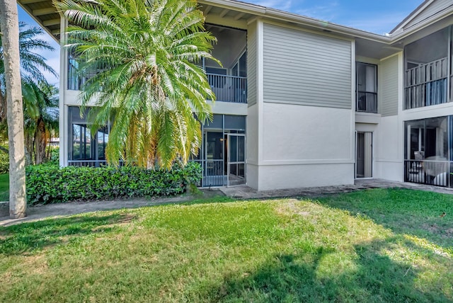 7655 Cinebar Dr Unit 105, Boca Raton, FL 33433 - view of home's exterior featuring a yard and stucco siding