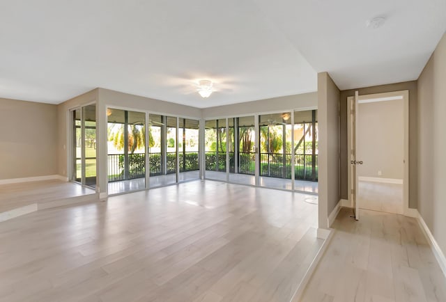 7655 Cinebar Dr Unit 105, Boca Raton, FL 33433 - unfurnished room with light wood-style floors and baseboards