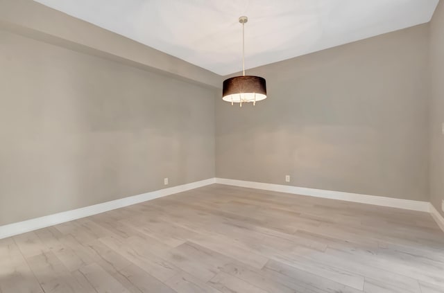 7655 Cinebar Dr Unit 105, Boca Raton, FL 33433 - spare room featuring light wood finished floors and baseboards