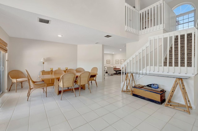 dining room with stairs and recessed lighting