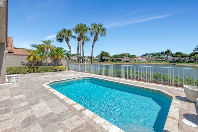 view of pool featuring a fenced backyard, a patio area, a water view, and a residential view
