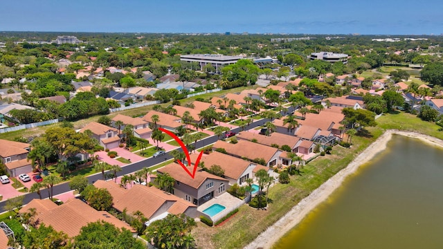 aerial perspective of suburban area featuring a nearby body of water
