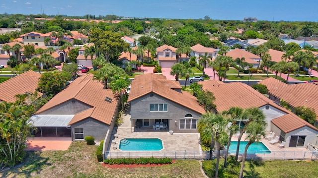 aerial view of residential area with a pool