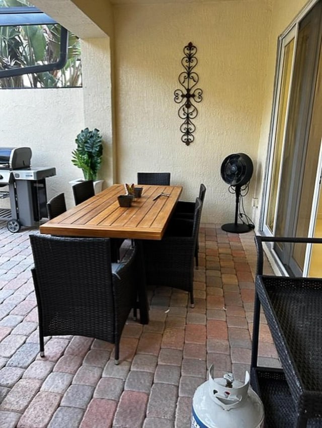 view of patio / terrace with a grill and outdoor dining space