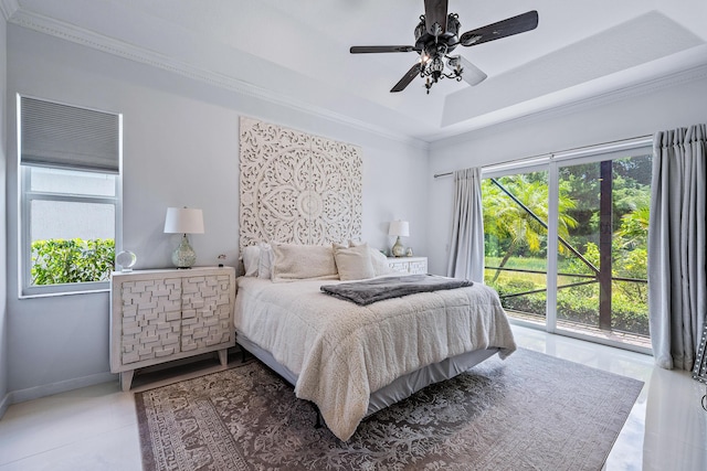bedroom featuring access to outside, ornamental molding, a tray ceiling, baseboards, and tile patterned flooring