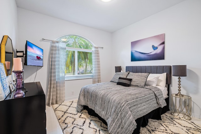 bedroom featuring baseboards