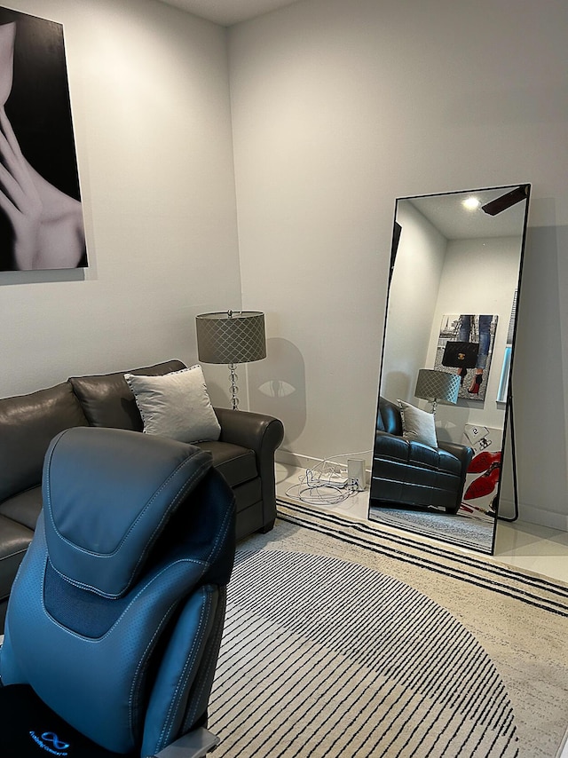 living room with speckle patterned floor and baseboards
