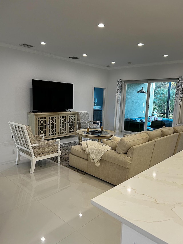 living room featuring recessed lighting and ornamental molding