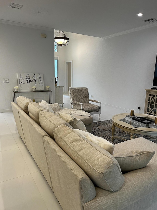 living room featuring ornamental molding, light tile patterned flooring, and baseboards