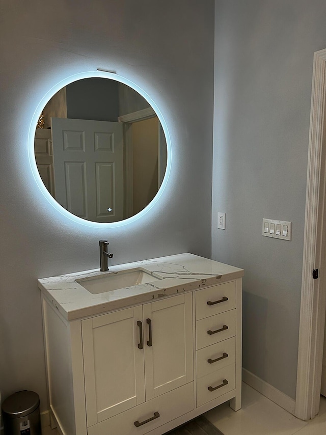 bathroom with vanity and baseboards