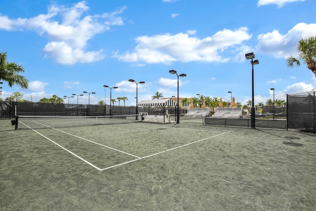 view of tennis court with fence