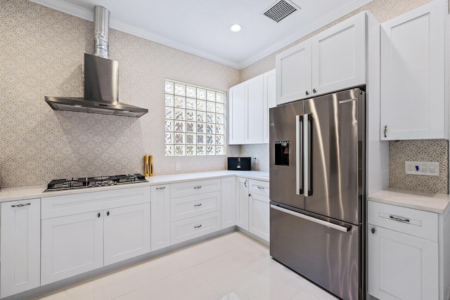 kitchen featuring stainless steel appliances, crown molding, light countertops, decorative backsplash, and white cabinetry