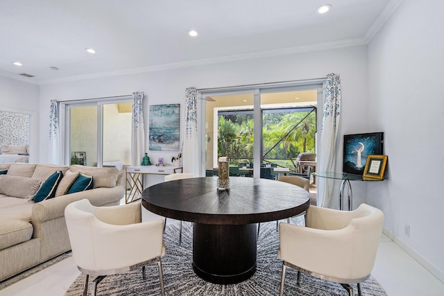 dining area with crown molding, recessed lighting, and baseboards