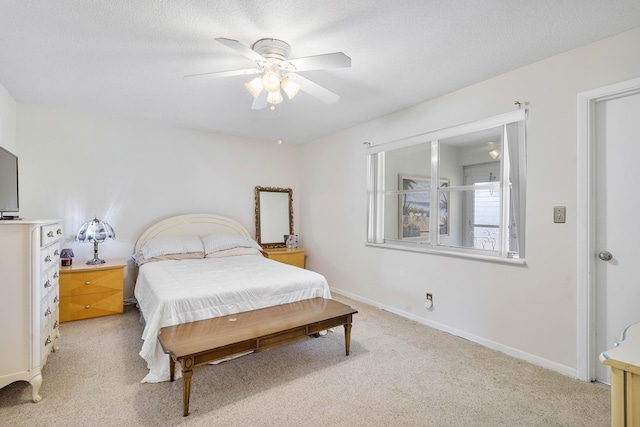 195 High Point Ter E Unit C, Delray Beach, FL 33445 - bedroom with a ceiling fan, baseboards, light carpet, and a textured ceiling