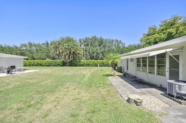 195 High Point Ter E Unit C, Delray Beach, FL 33445 - view of grassy yard with a patio area and central air condition unit
