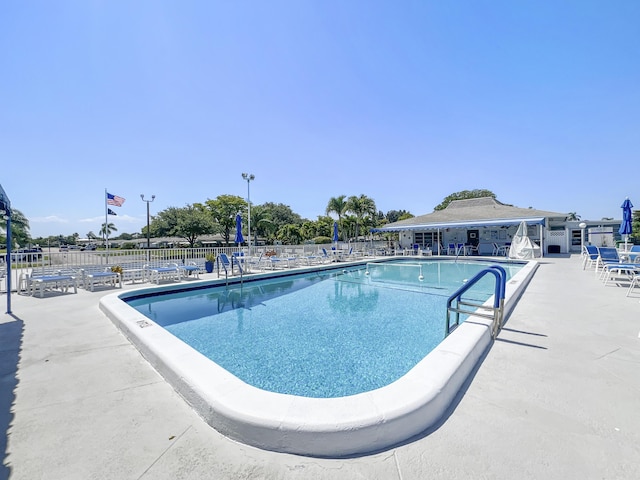 195 High Point Ter E Unit C, Delray Beach, FL 33445 - community pool with fence and a patio area