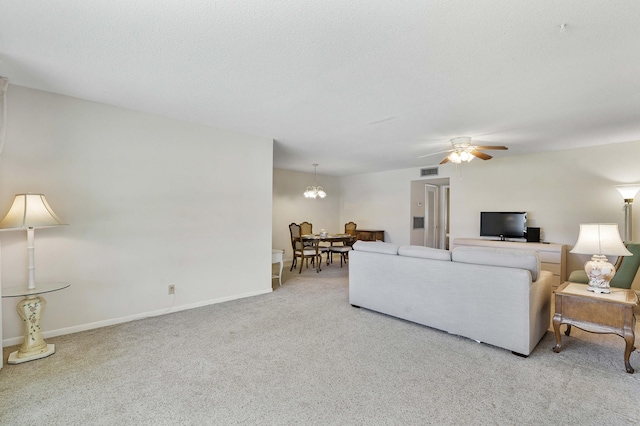 195 High Point Ter E Unit C, Delray Beach, FL 33445 - living room with carpet floors, ceiling fan, baseboards, and a chandelier