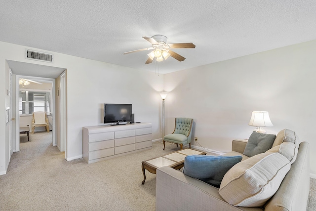 195 High Point Ter E Unit C, Delray Beach, FL 33445 - living area featuring ceiling fan, light carpet, a textured ceiling, and baseboards