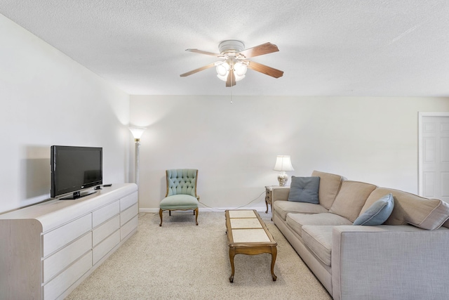 195 High Point Ter E Unit C, Delray Beach, FL 33445 - living room with a ceiling fan, light carpet, a textured ceiling, and baseboards