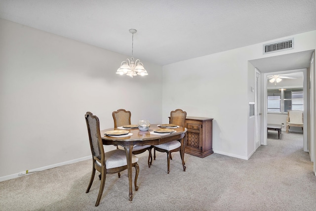 195 High Point Ter E Unit C, Delray Beach, FL 33445 - dining room featuring a chandelier, light colored carpet, and baseboards