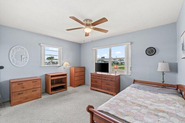 bedroom with carpet floors and a ceiling fan
