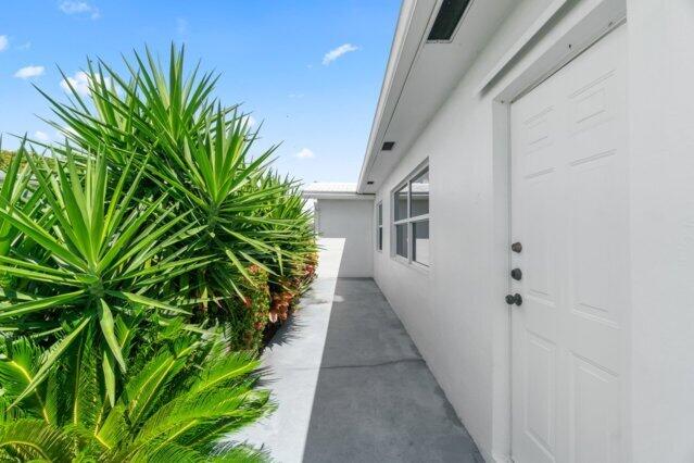 view of side of home with stucco siding