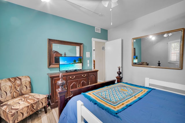 bedroom with wood finished floors and a ceiling fan