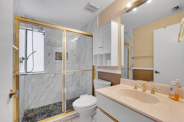 full bath with toilet, a marble finish shower, and vanity