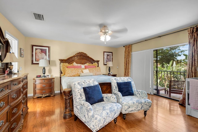 bedroom featuring access to exterior, light wood-type flooring, and ceiling fan
