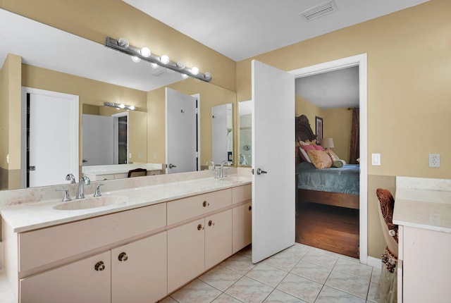 full bathroom with ensuite bathroom and double vanity