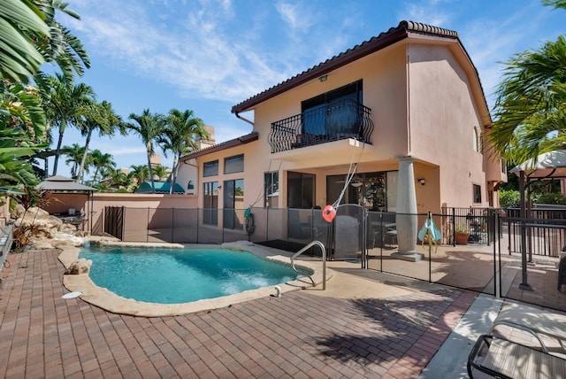 view of pool featuring a patio area and fence