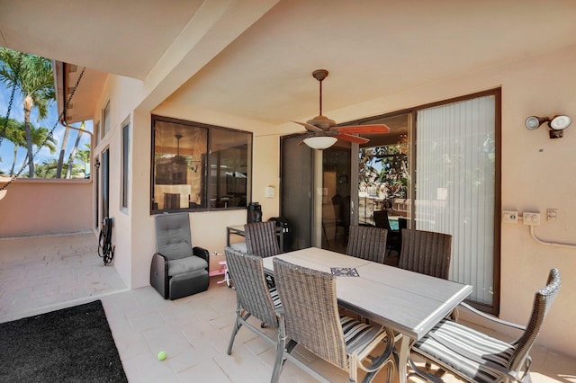view of patio / terrace with outdoor dining area and ceiling fan