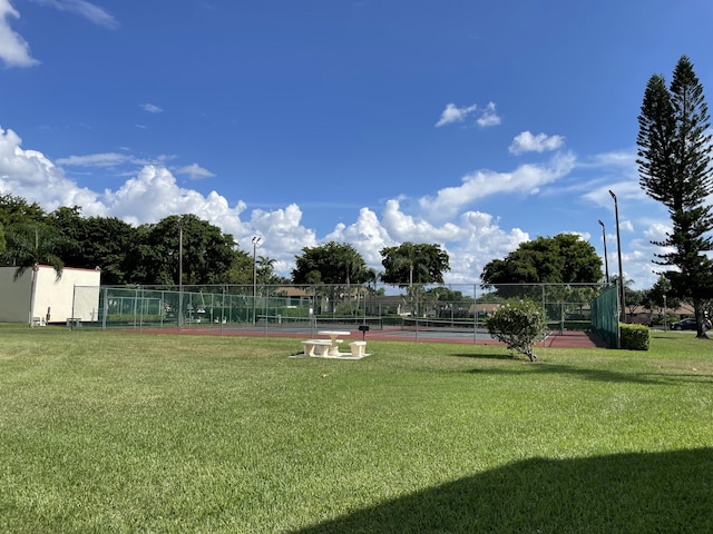 view of yard featuring a tennis court
