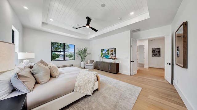 1105 NE 2nd Ave, Delray Beach, FL 33444 - bedroom with a tray ceiling, light wood-type flooring, recessed lighting, baseboards, and ceiling fan