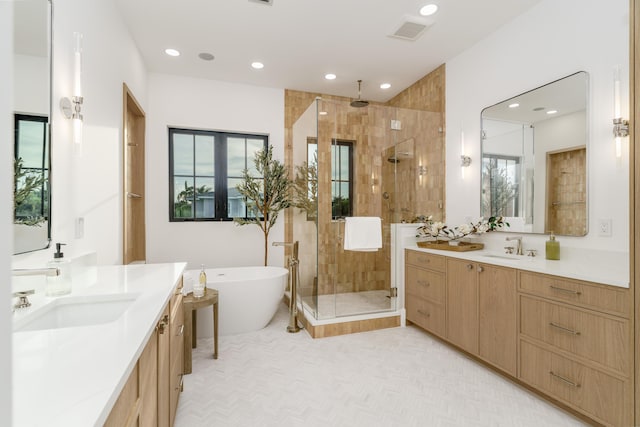 1105 NE 2nd Ave, Delray Beach, FL 33444 - full bath with a shower stall, a freestanding bath, recessed lighting, and two vanities