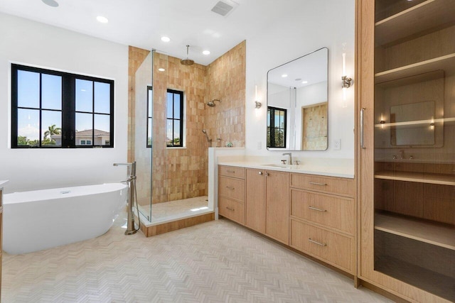 1105 NE 2nd Ave, Delray Beach, FL 33444 - full bathroom featuring a shower stall, a freestanding tub, vanity, and recessed lighting