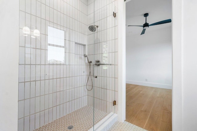 1105 NE 2nd Ave, Delray Beach, FL 33444 - bathroom with a stall shower, wood finished floors, and a ceiling fan
