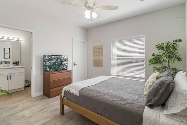 18 S D St, Lake Worth Beach, FL 33460 - bedroom featuring light wood-type flooring, ensuite bath, a ceiling fan, baseboards, and a sink