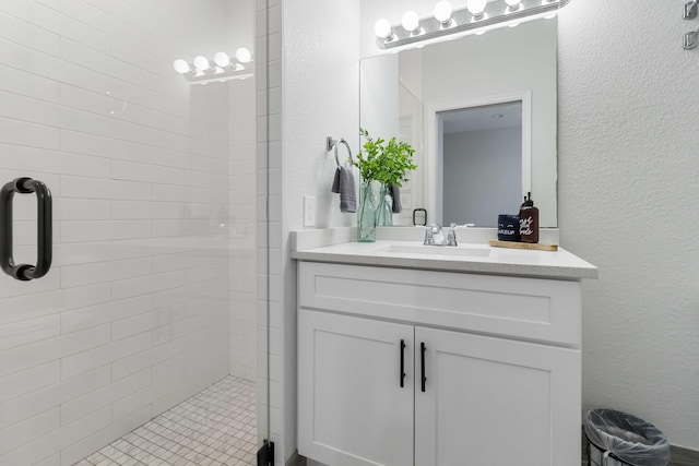 18 S D St, Lake Worth Beach, FL 33460 - bathroom with a stall shower, vanity, and a textured wall