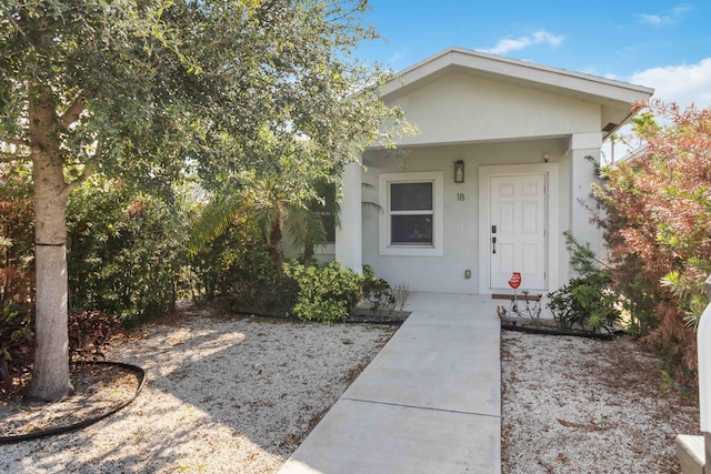 18 S D St, Lake Worth Beach, FL 33460 - view of exterior entry featuring stucco siding