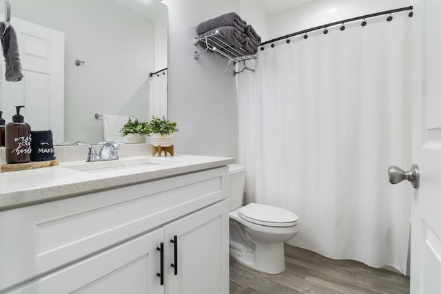 18 S D St, Lake Worth Beach, FL 33460 - bathroom featuring wood finished floors, toilet, vanity, and a shower with shower curtain