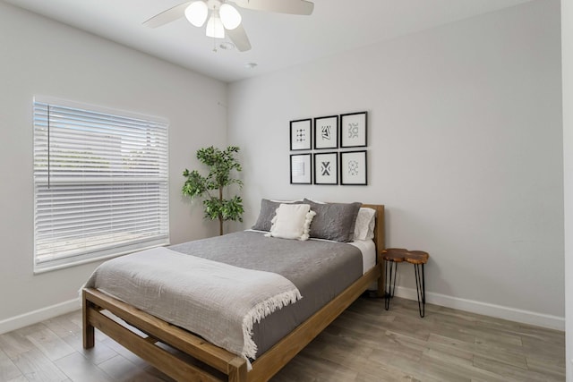 18 S D St, Lake Worth Beach, FL 33460 - bedroom featuring baseboards, light wood finished floors, and a ceiling fan