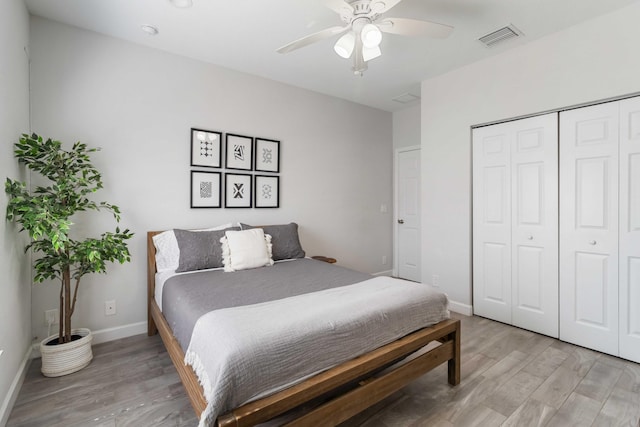 18 S D St, Lake Worth Beach, FL 33460 - bedroom featuring light wood finished floors, a closet, baseboards, and a ceiling fan