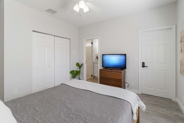 18 S D St, Lake Worth Beach, FL 33460 - bedroom featuring light wood-style flooring, a closet, ensuite bathroom, a ceiling fan, and baseboards