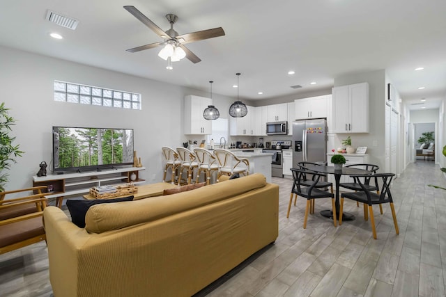 18 S D St, Lake Worth Beach, FL 33460 - living area with recessed lighting, a ceiling fan, and light wood-style flooring