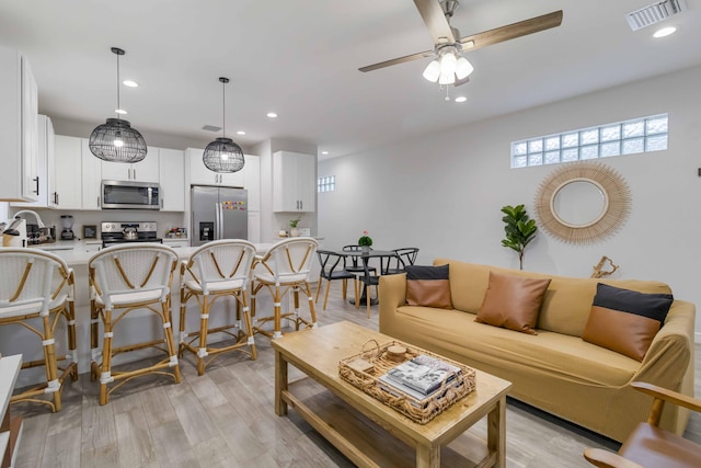 18 S D St, Lake Worth Beach, FL 33460 - living room featuring recessed lighting, ceiling fan, and light wood-style floors
