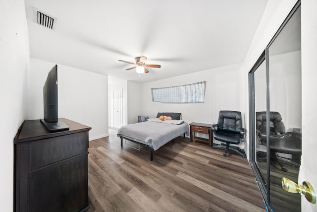 356 SE Prima Vista Blvd, Port Saint Lucie, FL 34983 - bedroom with a closet, dark wood-style flooring, and a ceiling fan