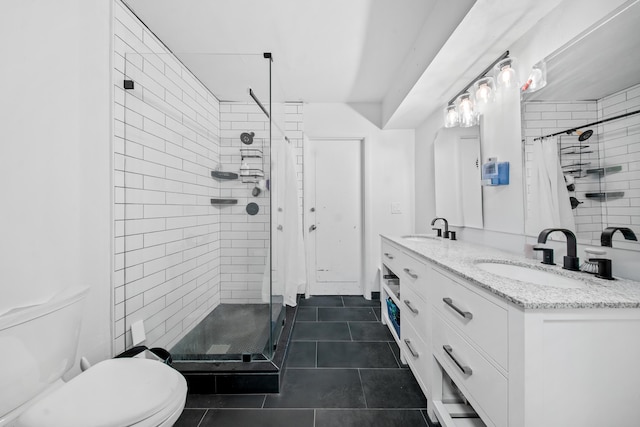 356 SE Prima Vista Blvd, Port Saint Lucie, FL 34983 - bathroom with a shower stall, toilet, tile patterned flooring, and double vanity