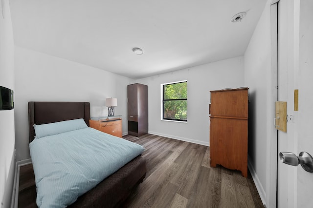 356 SE Prima Vista Blvd, Port Saint Lucie, FL 34983 - bedroom featuring wood finished floors and baseboards