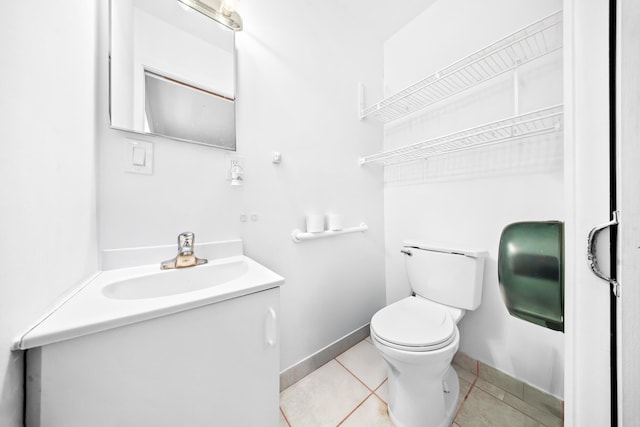 356 SE Prima Vista Blvd, Port Saint Lucie, FL 34983 - bathroom featuring vanity, toilet, tile patterned flooring, and baseboards